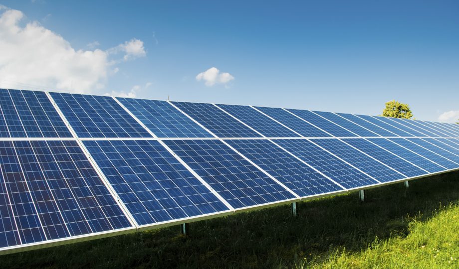 Solar power panels on green field